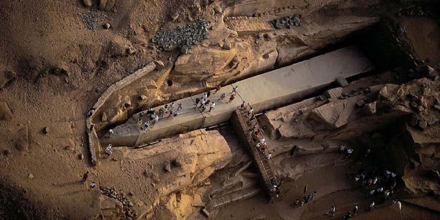 Aswan: High Dam, Unfinished Obelisk, Philae & Nubian Village - Reading the Unfinished Obelisk in the granite quarry