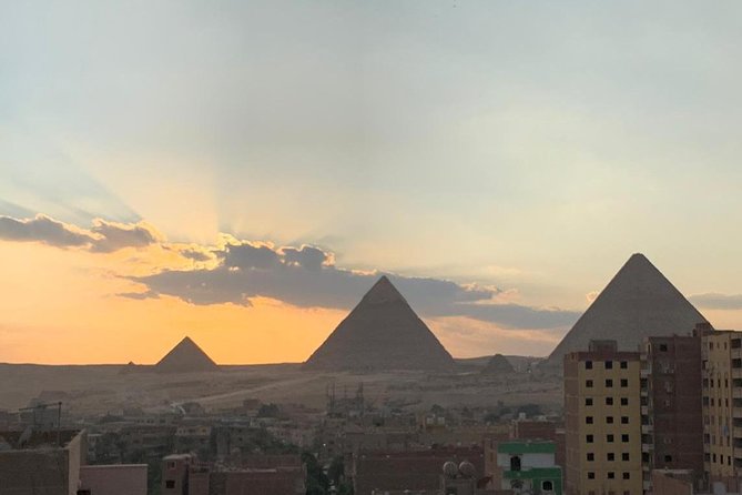 Best Full-Day Tour to Giza Pyramids Egyptian Museum and Bazaar - Starting at Giza with the three pyramids
