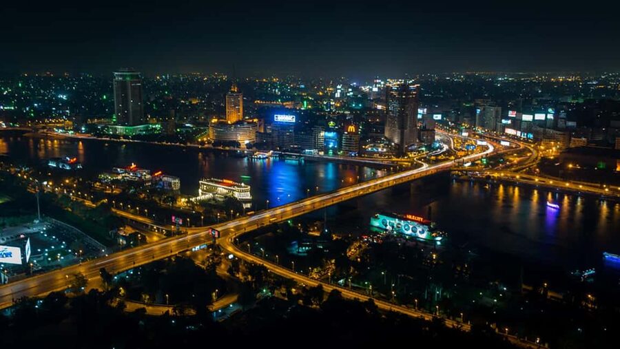 Cairo: Nile Dinner Cruise with Belly Dancer Show and Music - Cairo’s lights from the open-air deck
