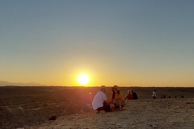 Camel Ride, Bedouin Dinner and Star Gazing in Marsa Alam - A small cliff and the desert sunset