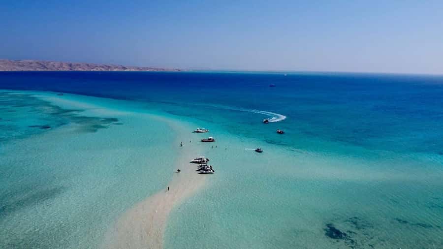 Hurghada: Elegance Yacht Cruise To Orange & Magawish island - Optional parasailing above the sea
