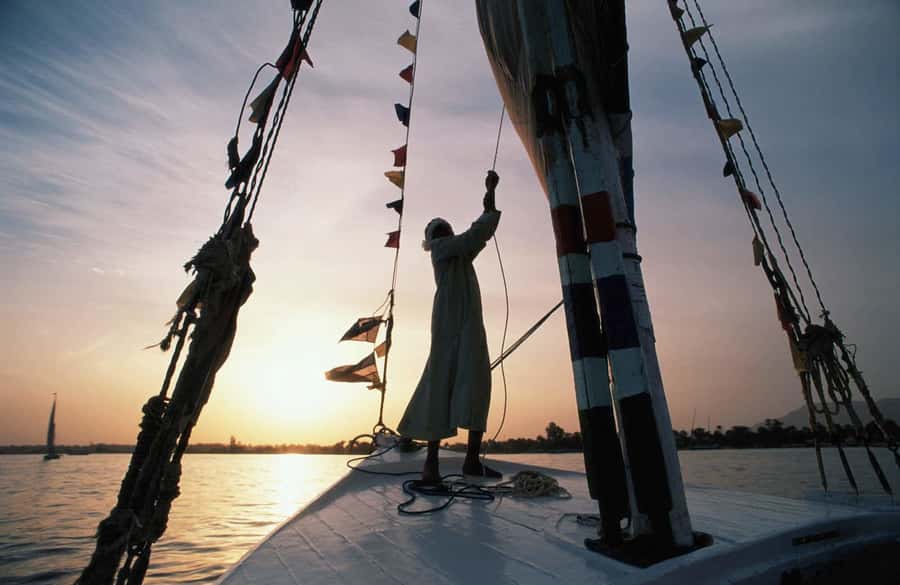 Luxor: Private Felucca Boat Trip with Hotel Pickup - Boarding the felucca and settling in
