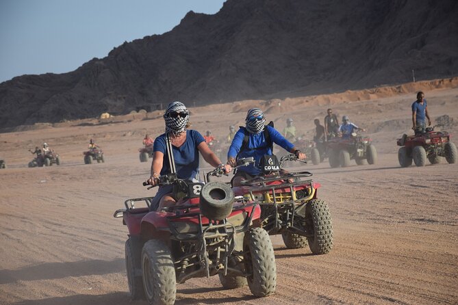 Safari Quad Bike Adventure, Camel, Show, Dinner & Stargazing - Racing across the desert by quad