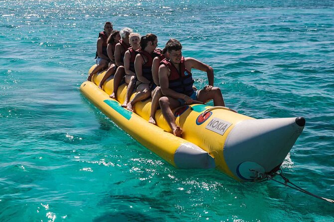 Snorkeling Tours Hurghada Boat excursions Orange bay Trip - Wooden huts, umbrellas, and a slower island hour