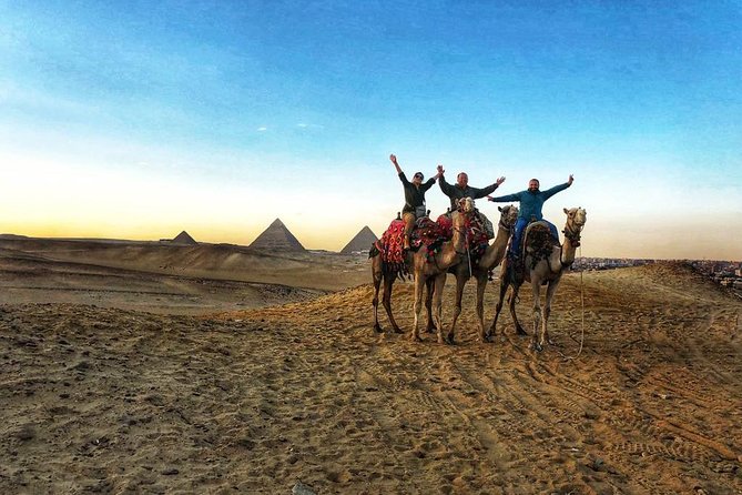 sunset at Giza pyramids by camels - The pyramid view is distant, but that can be the point
