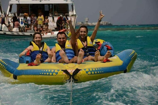 Swimming with Dolphins and Banana Boat Sea Trip Day Experience - Hurghada - The crew, music, and mood on the boat