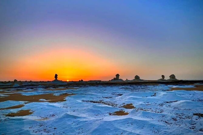 White & Black desert camping tour 2 Days 1 night From Cairo - Black Desert: dark hills above the sand